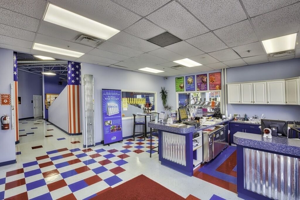 Front desk and lobby at Troy American Fitness