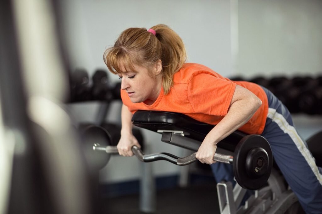 Member training with free weights at Troy American Fitness in Troy, IL