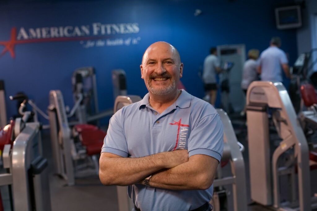 Staff member on the strength floor at Troy American Fitness